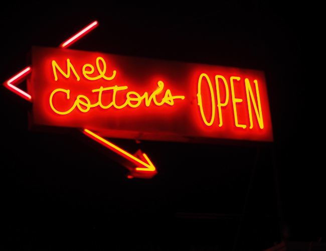 Endangered Places in an Urban Setting Exhibit; Photograph of neon sign that says "Mel Cotton's OPEN""