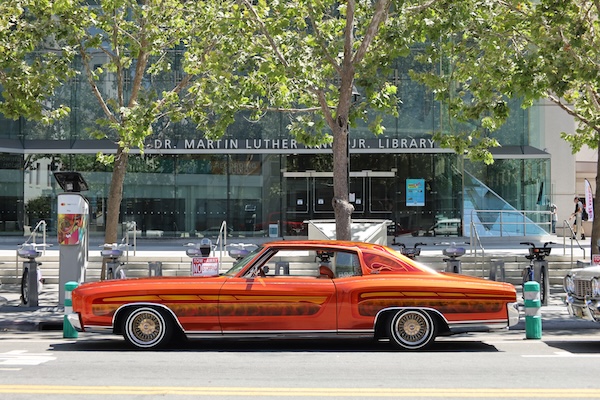 Lowrider car outside of the library on San Fernando street