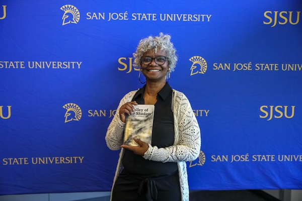 SJSU Staff holding their published book