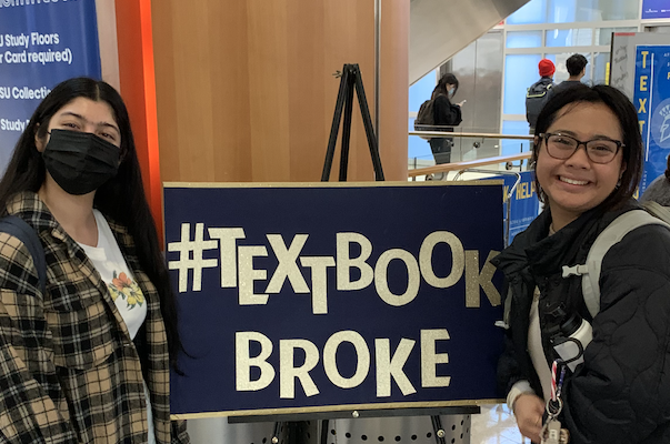 Photo of Sarah and Tanisha at the library's textbook broke event 