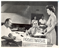 Japanese man being instructed as to his rights under military order of  time and departure to his designated assembly center by Assistant Provost Marshall in the Visalia, Control Station